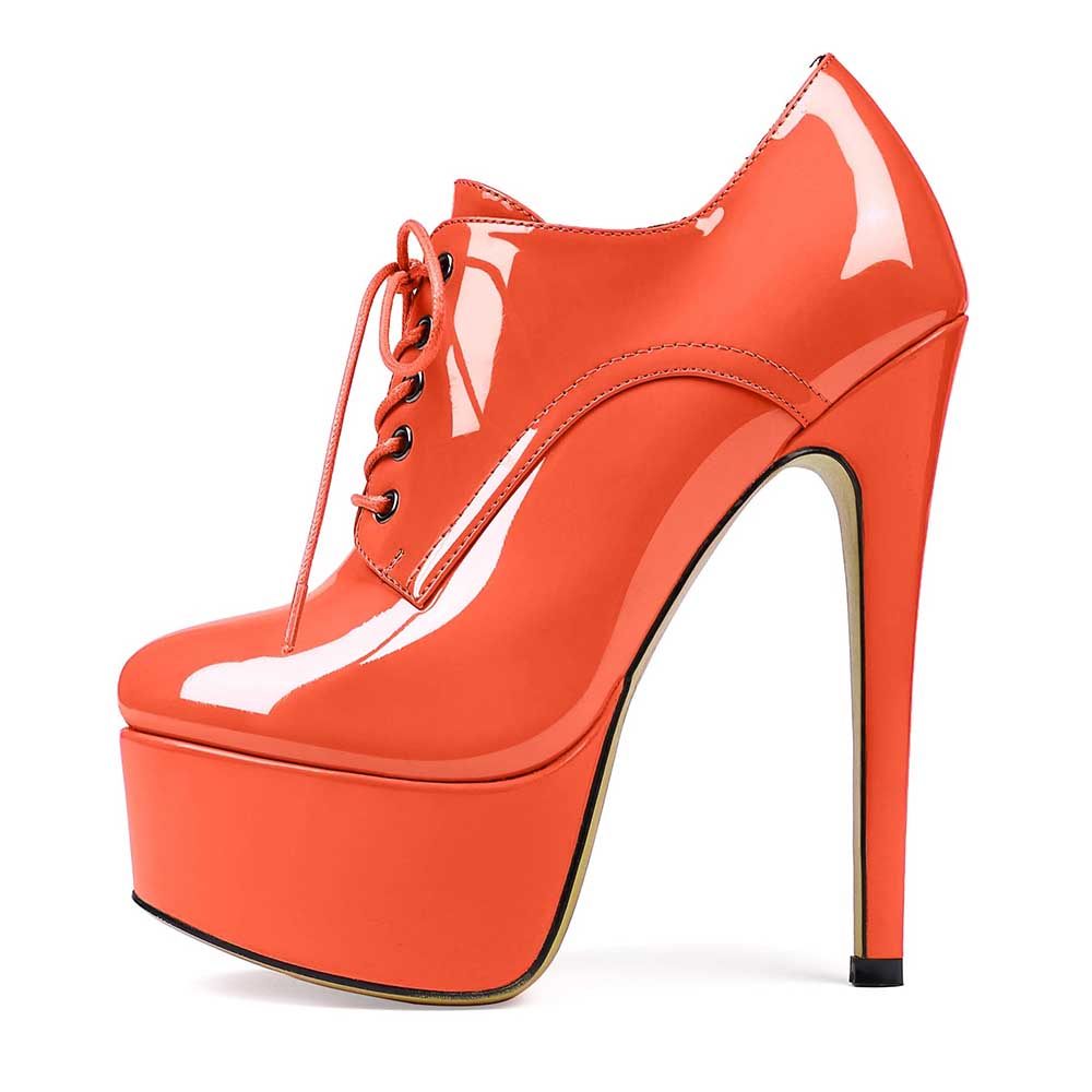 Orange high heel platform ankle boots with lace-up front and glossy finish