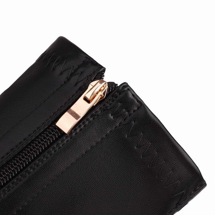 Close-up of black chunky heeled boots for women with gold zipper detail and stitched leather material