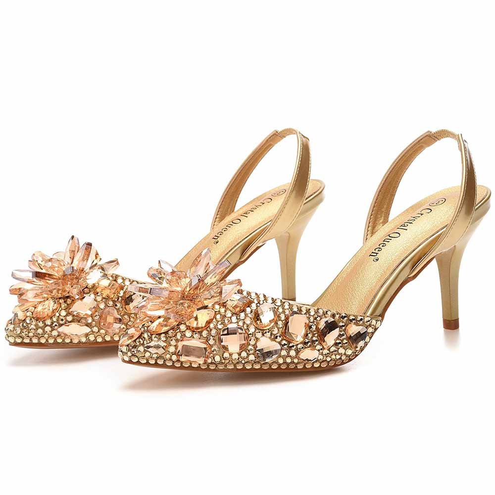 Crystal embellished low heels by Crystal Queen in gold with decorative stones and slingback design