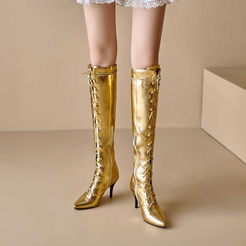 Gold knee-high lace up heeled boots for women with pointed toe and slim stiletto heel