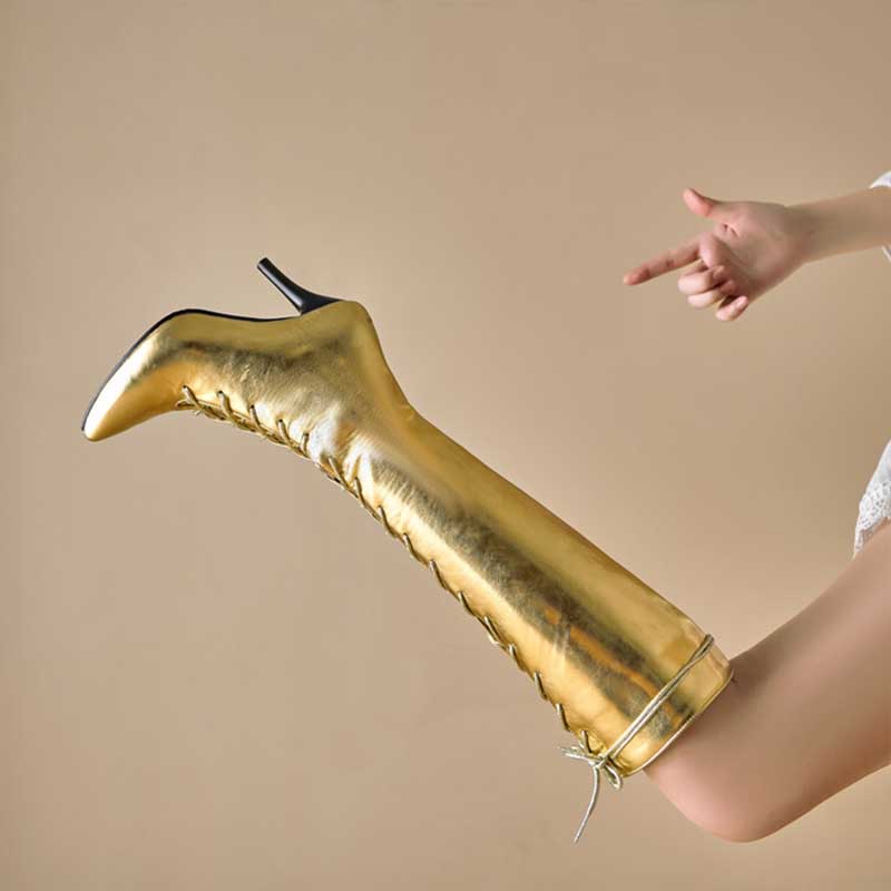 Shiny gold lace up heeled boots for women with pointed toes and slim black heels