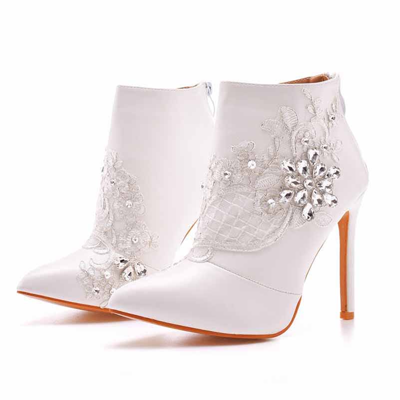 lace wedding boots for bride with pointed toes and high stiletto heels embellished with floral lace and rhinestones