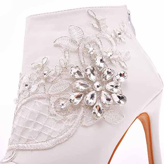 lace wedding boots for bride featuring intricate lace and crystal embellishments on white heels