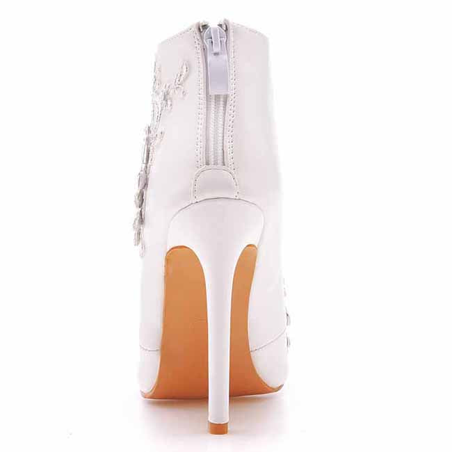 white lace wedding boots for bride with high stiletto heel and back zipper closure