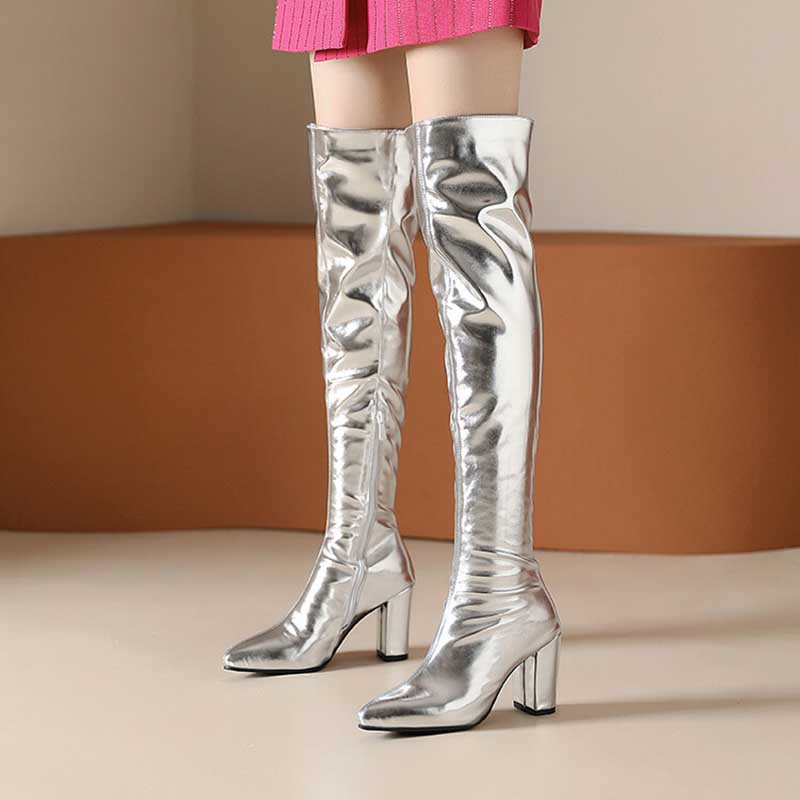 Metallic over the knee boots women in shiny silver with block heels styled with pink skirt
