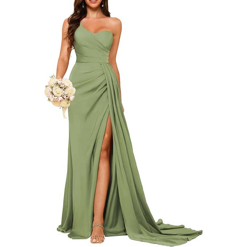 Elegant green one shoulder bridesmaid dress with draped waist and high slit holding bouquet