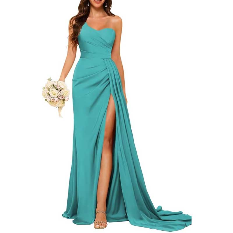 Teal one shoulder bridesmaid dress with side slit and flowing train holding bouquet
