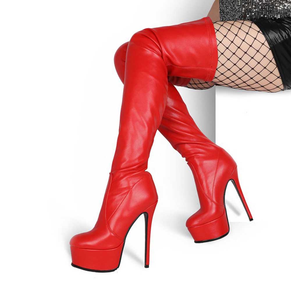 Red overknee stiletto boots for women with platform heels styled with fishnet stockings