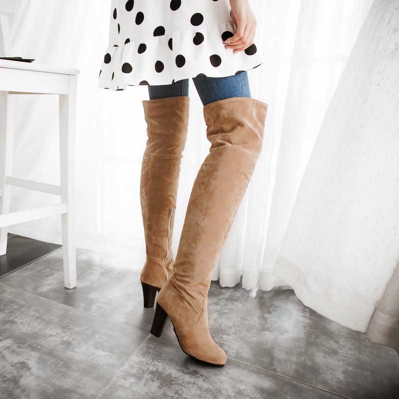 Brown suede plus size thigh high boots for women with block heels worn with jeans and polka dot dress