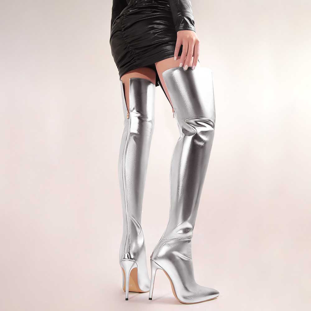 Shiny leather high heel over the knee boots for women in metallic silver worn with a black mini skirt