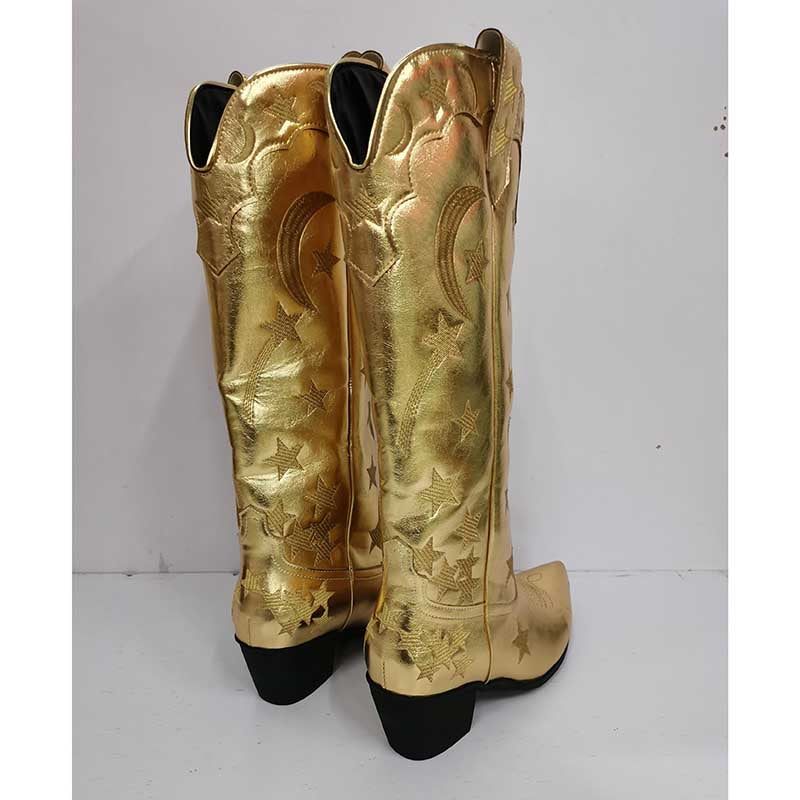 Gold cowboy star pattern knee high boots with black heels and decorative moon and star designs