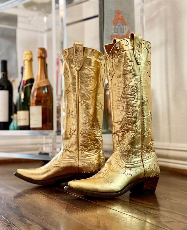 old cowboy star pattern knee high boots with pointed toes and stacked heels