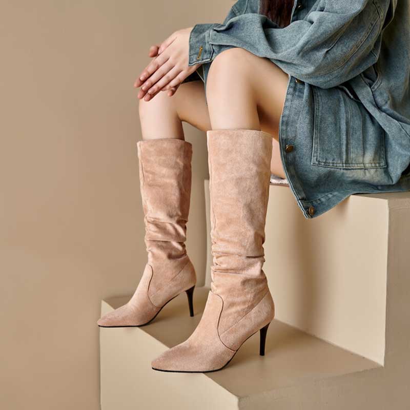 Beige suede knee high boots for special occasions with pointed toes and slim heels