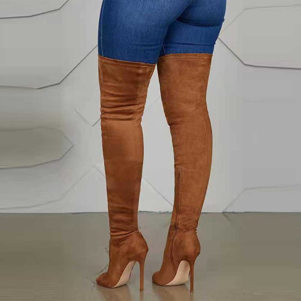 Brown suede high heeled over the knee boots for women paired with blue skinny jeans