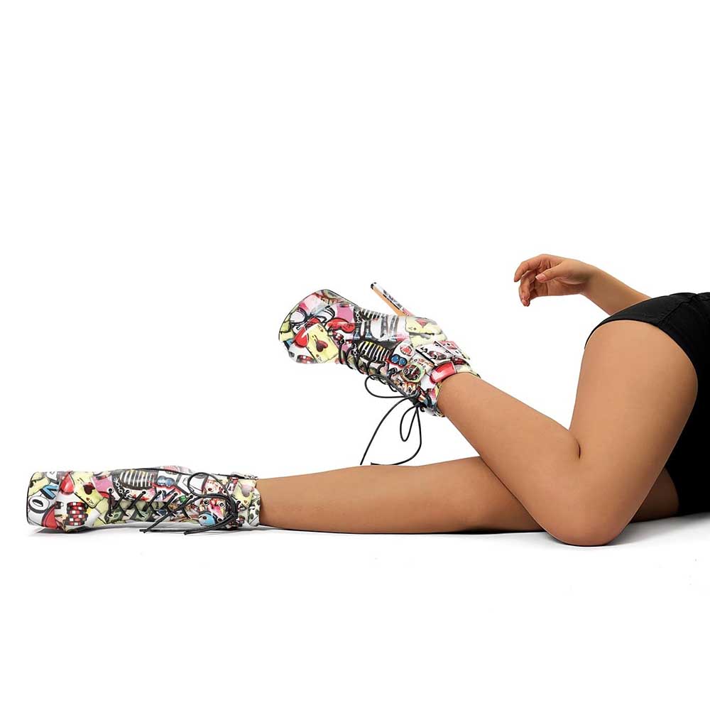 Multi-color platform ankle boots with lace-up design worn by model lying down in black shorts
