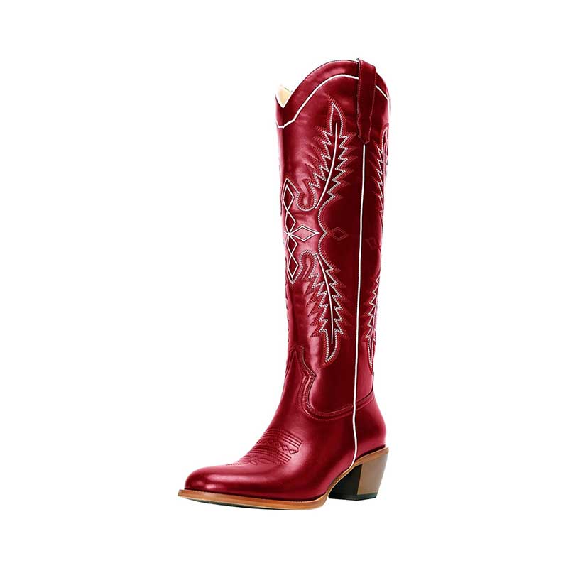 Vintage knee high cowboy boots in red leather with intricate stitching and a low heel