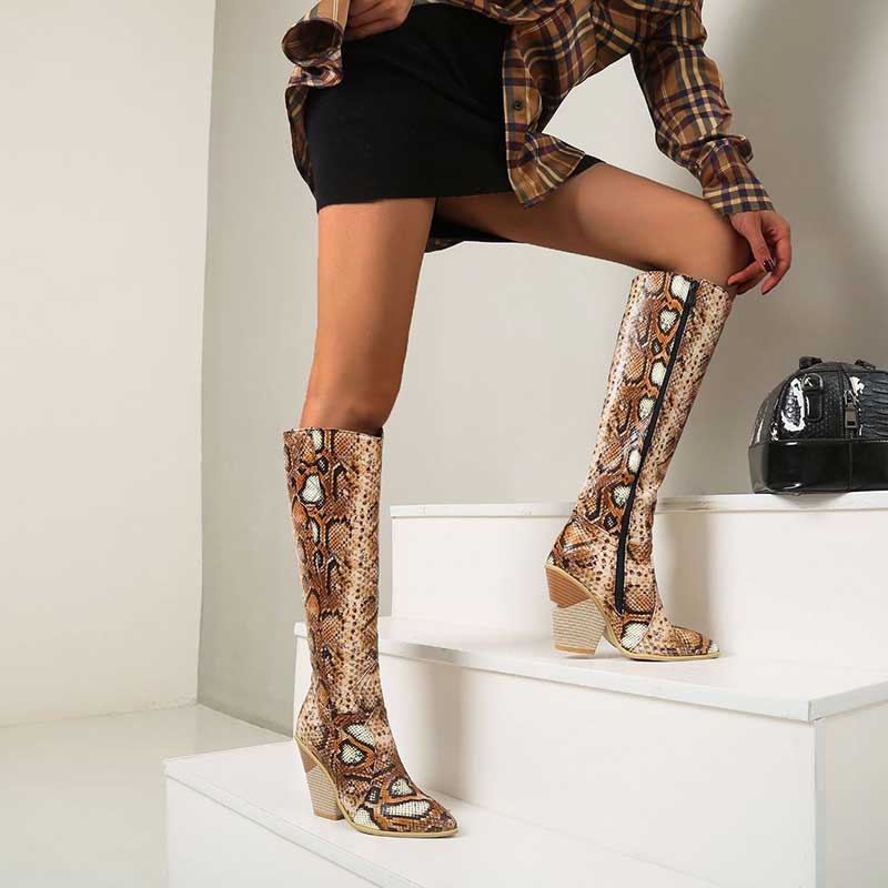 NONEBT western wedding guest boots in snakeskin pattern worn with black skirt and plaid shirt