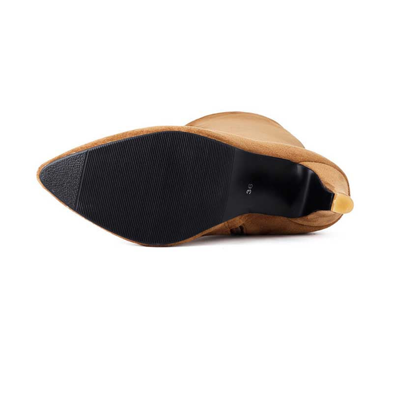 Bottom view of women's suede knee-high boots showing black textured sole and tan suede upper