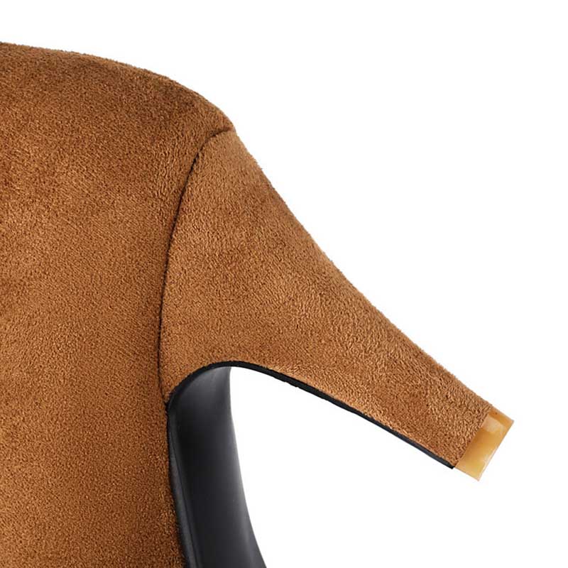 Close-up view of brown women's suede knee-high boots showcasing textured material and block heel