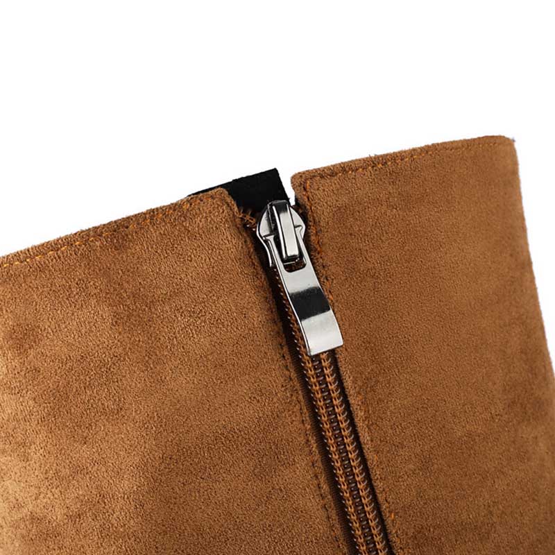 Close-up of brown women's suede knee-high boots showing smooth suede texture and zipper detail