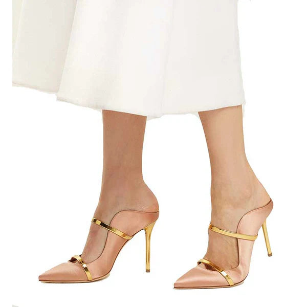 Stylish dress shoes with a pointed toe and gold accents, ideal for formal occasions and elegant outfits.