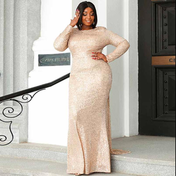 Stunning woman in a sequined gown showcasing a Plus Size Formal Dress on a stylish staircase.