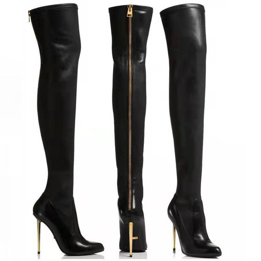 Black pointed toe over-the-knee boots with gold high heels and back zipper detailing