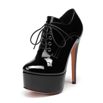 Black round toe booties for women with high platform heel and lace-up design
