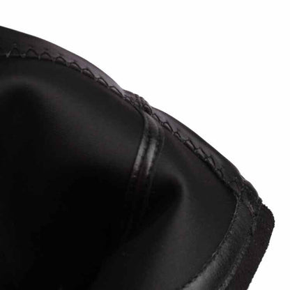 Close-up view of black chunky heeled boots for women showing smooth leather and stitching details