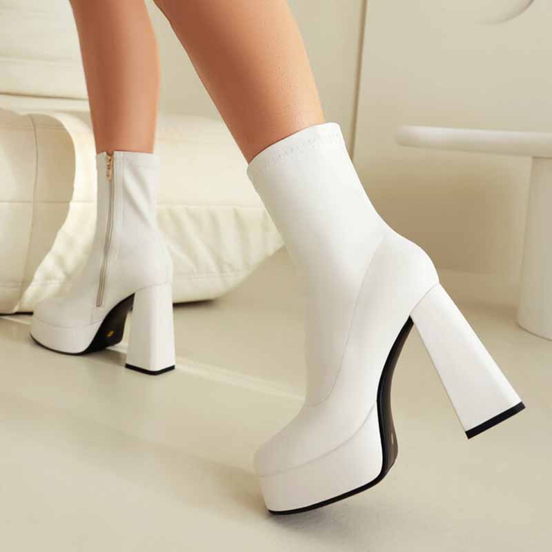 White chunky heeled boots for women with side zipper and platform sole on model