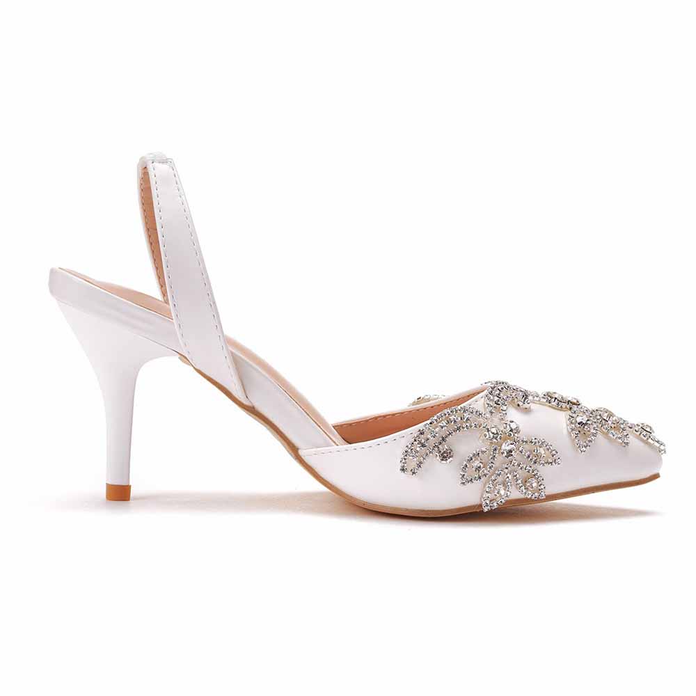 Crystal Queen white bridal rhinestone pumps with mid heel and decorative rhinestone floral design