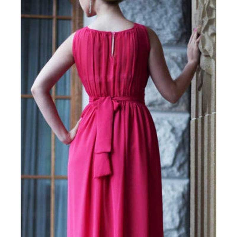 Back view of custom long chiffon bridesmaid dress in bright pink with sleeveless design and waist tie