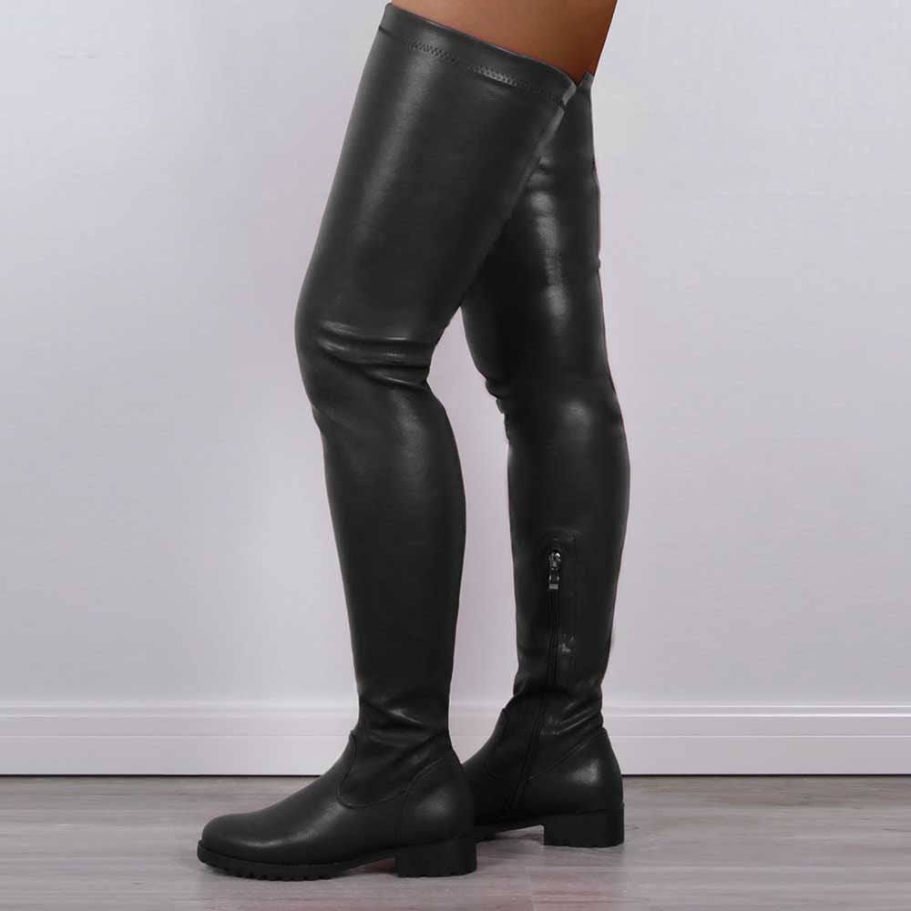 Black extra long platform boots for women reaching above the knee with low block heels