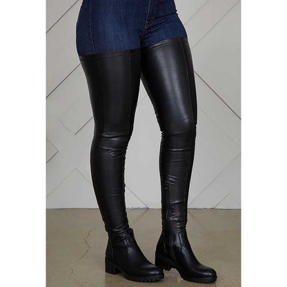 Black extra long platform boots for women with low block heels and knee-high design