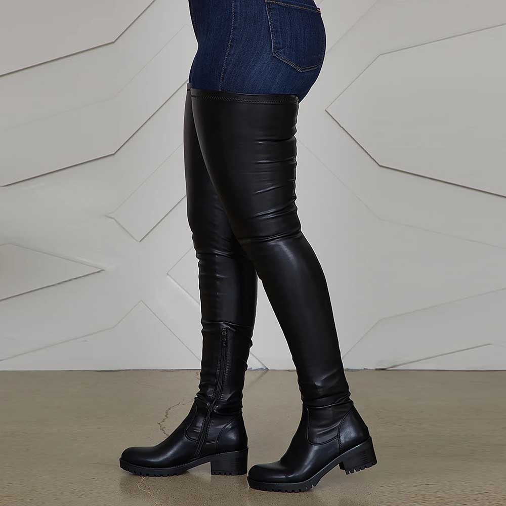 Black extra long platform boots for women made of faux leather with chunky heels and side zippers