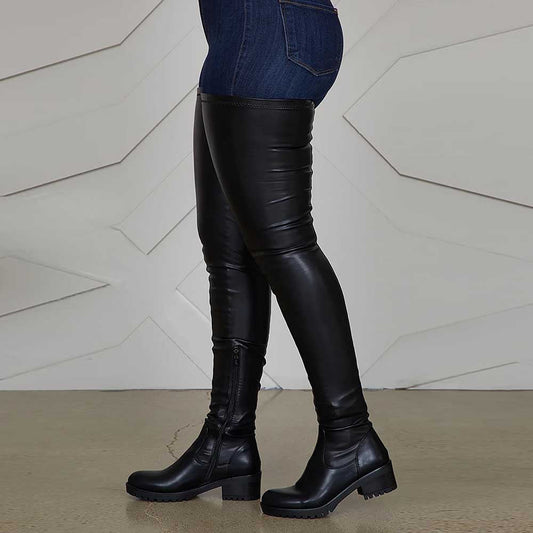 Black extra long platform boots for women made of faux leather with chunky heels and side zippers