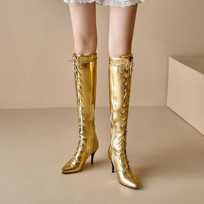 Gold knee-high lace up heeled boots for women with pointed toe and slim stiletto heel