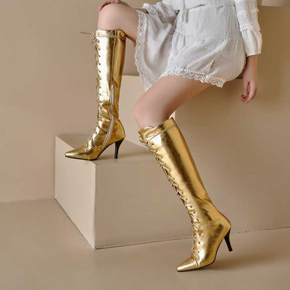 Gold lace up heeled boots for women with pointed toes and mid-height stiletto heels