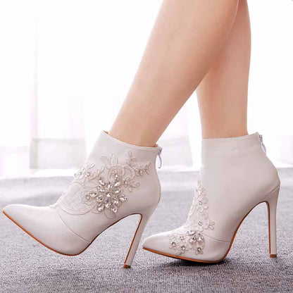 lace wedding boots for bride with high stiletto heels and floral embellishments