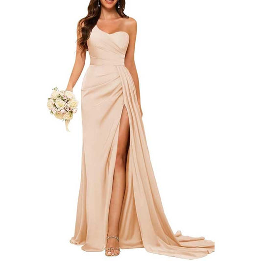 Elegant beige one shoulder bridesmaid dress with a thigh-high slit and flowing train