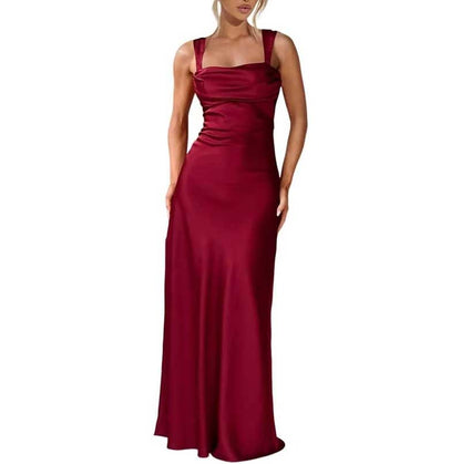 Red spaghetti strap bridesmaid gown with a fitted bodice and floor-length skirt prom dress