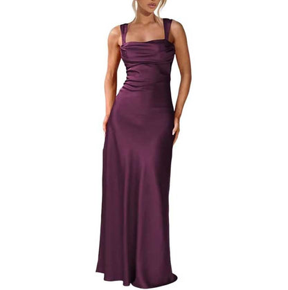 Elegant purple spaghetti strap bridesmaid gown with a fitted bodice and flowing skirt for formal events