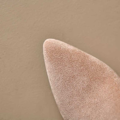 Close-up of pointed toe on beige suede knee high boots for special occasions