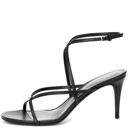 Black strappy open toe summer dress heels with buckle ankle strap and mid-height stiletto heel