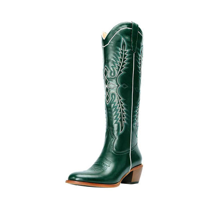 Vintage knee high cowboy boots in green leather with intricate stitching and a mid heel