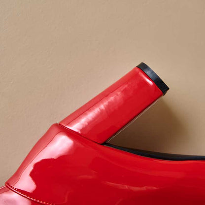 Red glossy women's chunky heel boots for prom with black trim detailing on heel and edge