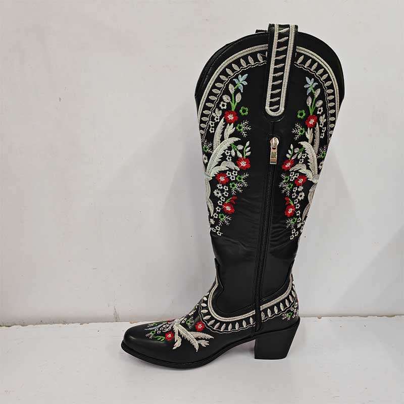 Black women's embroidered cowboy boots with colorful floral embroidery and side zipper