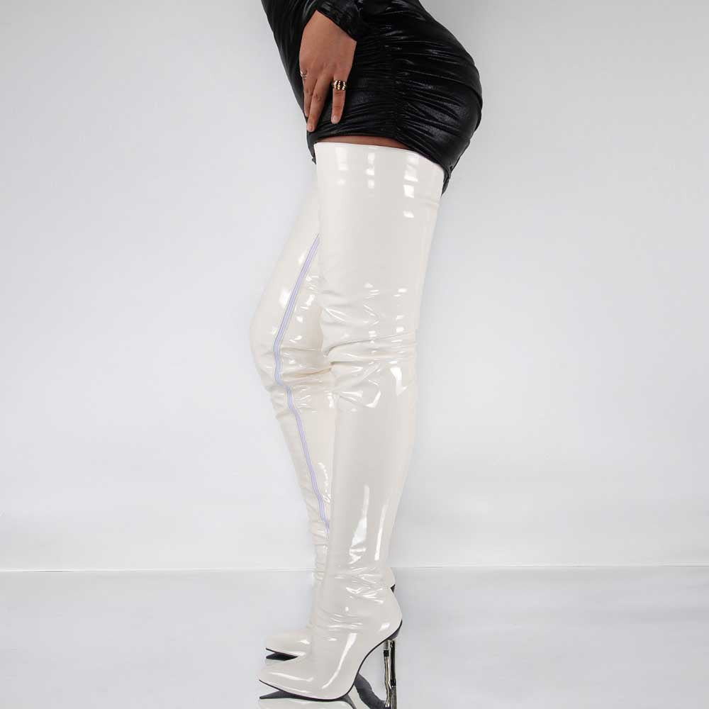 White patent leather women's over the knee stiletto boots paired with a black mini dress